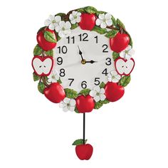 a clock that has apples and flowers on it