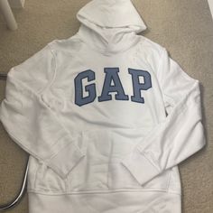 New With Tags Gap Hoodie. Size Large. Retail $54.95. Heard They Were Trending So Get It Before Prices Sky Rocket :)))) Gap Tops For Spring Streetwear, Gap Sporty Top With Drawstring Hood, Sporty Gap Top With Drawstring Hood, Casual Gap Tops With Drawstring Hood, Gap Long Sleeve Tops With Drawstring Hood, Sporty White Gap Tops, White Gap Tops For Streetwear, Gap Sweatshirt, Gap Hoodie