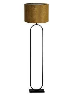 a floor lamp with a gold shade on the base and a black metal frame around it