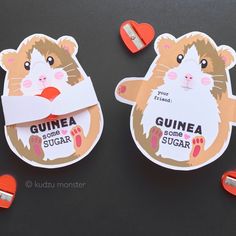 two stickers with the words guinea some sugar on them and an image of a hamster sticking out of it