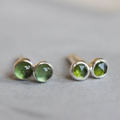 These moss green Tourmaline Stud Earrings are so charming and adorable that you just can't help admiring their simple beauty. They are tiny, minimalist and lightweight, so they can become your favorite everyday accessory. Choose the size of the stone (3 or 5 mm) and material for the earrings (sterling silver or 14k gold filled). If you want to order solid gold studs, feel free to contact me. You may choose the stone finish - it can be rose cut or smooth. The earrings are made to order, it takes Minimalist Earrings Studs, Minimalist Studs, Tiny Studs, Tiny Stud Earrings, Everyday Accessories, Simple Beauty, October Birthstone, Green Earrings, Green Tourmaline