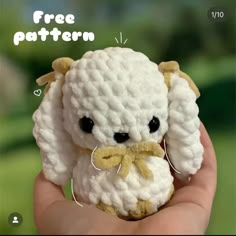 a hand holding a small white crocheted stuffed animal with the words free pattern below it