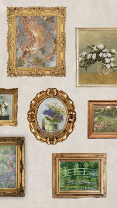 there are many paintings on the wall and one has a vase with flowers in it