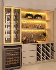 a wine cellar with many bottles and glasses on the shelves in front of it is lit by lights