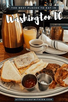 a white plate topped with lots of food on top of a wooden table next to a coffee pot