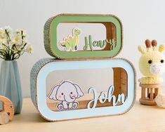 there are two tins with animals on them and one has a name in the middle