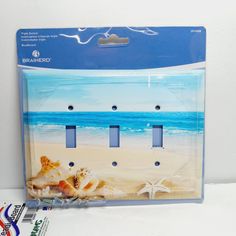 two seashells and starfish on the beach light switchplate cover in plastic