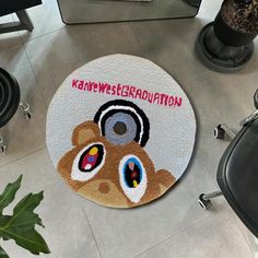 a round rug with an image of a teddy bear and the words kannyswerkration on it