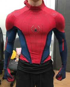 a man in a red and blue spiderman costume