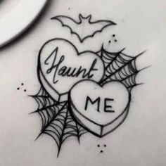 two heart shaped tattoos with the words yount me written on them and spider webs