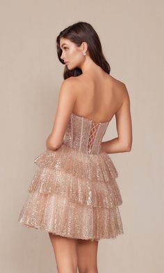 Simply gorgeous, this strapless short champagne glitter homecoming dress Y863 is the epitome of modern glamour. Crafted in glittery champagne fabric from the notched neckline to the hem, this strapless short party dress sparkles in the spotlight whether you are going to homecoming, a sweet-16 party, or another semi-formal event. The strapless short cocktail dress has a corset-style bodice that wraps around to the lace-up back, while the adorable short a-line skirt flows to the hem in ruffled tie Champange Hoco Dress, Champagne Evening Mini Dress For Prom, Champagne Mini Dress For Prom Season, Glamorous Champagne Mini Dress For Homecoming, Champagne Prom Season Mini Dress, Glitter Hoco Dress, Glitter Homecoming Dress, Champagne Fabric, Glitter Party Dress