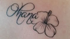 a tattoo on the back of a woman's shoulder that says, hope with a flower