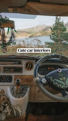 the interior of an old car is decorated with flowers and greenery, along with steering wheel controls