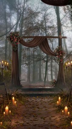 an outdoor wedding setup with candles and drapes on the ground in front of trees