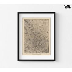 an old map of the city of london, england in black frame on a white wall