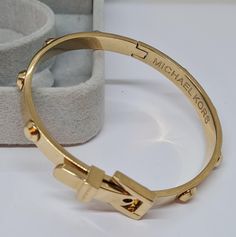 Vintage MICHAEL KORS buckle bracelet. Gloss gold-tone cuff bracelet. Bracelet length: 17×1.2 cm/7.5×0.5 inches. Mark- Michael Kors. Condition- perfect vintage. Maybe you want to see other bracelets too: https://www.etsy.com/shop/VintageVoyageLT?ref=seller-platform-mcnav&section_id=32036696 You can write me a message if you have any questions. Glad you visited my store! Have a great time! Michael Kors Bracelet, Michael Kors Jewelry, Buckle Bracelet, Vintage Bracelet, Cuff Bracelet, Favorite Jewelry, Cuff Bracelets, Jewelry Bracelets, Gold Tones