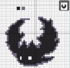 a cross stitch pattern with an image of a black and white cat's head