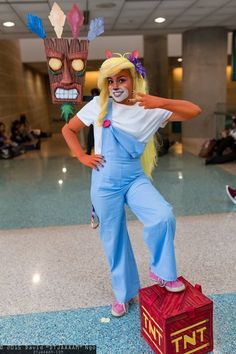 a person dressed in costume standing on top of a box