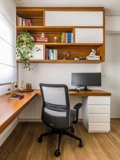 an office with a desk, chair and bookshelf