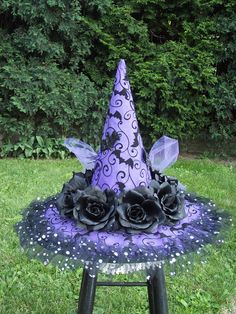 a purple witch hat sitting on top of a stool