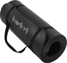 a black yoga mat with the words hemingley yeeh on it's side