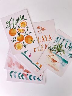 four greeting cards with the words florida and oranges in watercolor on white paper