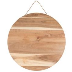 a round wooden board hanging on a rope