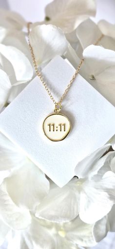 11:11 is rooted in numerology and can have spiritual meaning.  Seen as an angel sign, 11:11 is associated with new beginnings.   This beautiful necklace has an 18K Gold-Filled 11:11 pendant with white enamel.  Set on a 16" adjustable length gold necklace.  It's a simply beautiful necklace for everyday wear.   11:11 Pendant is 100% lead and nickel free, hypoallergenic, anti tarnish and waterproof. Necklace chain is a gold color metal with lobster clasp. Allergy Disclaimer: Some people are allergi Waterproof Necklace, Angel Number Necklace, Angel Signs, Spiritual Necklace, Number Necklace, Spiritual Meaning, Angel Number, Beautiful Necklace, Gold Plated Necklace