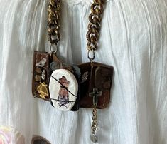 28 inch. Vintage worn leather base with original rivets and seams. I made a clay pendant with charming image and wire wrapped it as centerpiece. Accented with bits and bobs . Suspended from beatup , upcycled chains. Stunner! Rocker Chick, Assemblage Necklace, Boho Pendant, Found Object, Squirrels, Vintage Wear, Diy Jewelry Making, Rivets, Vintage Leather