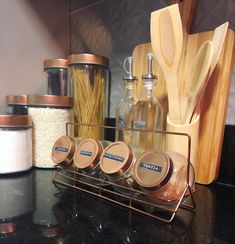 the kitchen counter is stocked with spices and cooking utensils