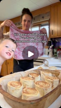 a woman and child in the kitchen making cinnamon roll recipe with text that reads, it's been while since i have shared the cinnamon roll recipe