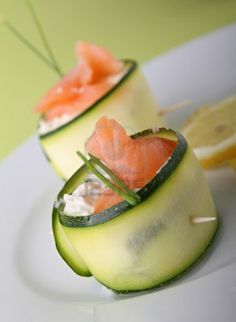 cucumber slices and salmon on a white plate