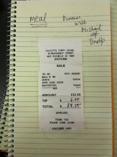 a receipt sitting on top of a notebook