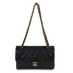 A timeless classic that never goes out of style, the flap bag from Chanel dates back to 1955 and has seen a number of updates. The design was revolutionary for its time, giving its wearers the freedom to carry their everyday must-haves without the cumbersome nature of a larger bag. The bag features the classic leather-entwined chain-link shoulder strap for a distinctive aesthetic. Item #: 130963 Dimensions: 9 x 6 x 2.5 Includes: Care Booklet;Authenticity Card Exterior Material: Leather Size: Small Circa: 2000-2002 Exterior Color: Black Strap Length: 9-16 Made in: France Condition: Good Chanel Flap Bag, Classic Flap Bag, Chanel Vintage, Large Bag, Vintage Chanel, Classic Flap, Classic Leather, Flap Bag, Timeless Classic