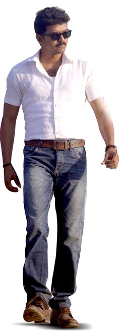 a man in white shirt and jeans walking with his hands in his pockets while wearing sunglasses