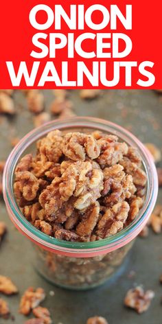 a glass bowl filled with walnuts on top of a metal table next to a red sign