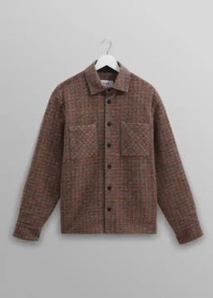 Year-round staple, returns in a new wool mix with a burgundy, blue and orange check design and features environmentally-friendly Corozo nut buttons and front patch pockets. Is it a shirt? Is it a mid-layer? Is it a jacket? It's all of those things and much, much more. 60% polyester, 30% wool, 10% acrylic Wash on cold or dry clean Cool Clothing, Check Design, Cheque Design, Bottle Bag, Scarf Men, Blue And Orange, Mens Skin Care, Sweater Pants, Reusable Bags