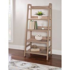 a wooden shelf with books and plants on it