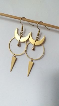 Big Gothic Witchy Moon Earrings 🌕 . This pair is made of hypoallergenic brass parts. No Nickel and no Lead. . Light to wear and easy to combine. 🌿 . The item will arrive to you wrapped as a gift in a paper gift bag. 🎁 . 》SHIPPING: If you need a tracking number for your order change the shipping option before checkout. 🌎 . If you have any questions please contact me, I usually respond quite fast 💌 . 》Please before ordering read my shop's announcement and check carefully the estimated deliver Mystical Gold Moon Phase Earrings, Handmade Gothic Gold Earrings, Symbolic Moon Charm Earrings, Gothic Metal Jewelry With Moon Phase Detail, Symbolic Metal Earrings With Moon Charm, Nickel-free Crescent Copper Jewelry, Gothic Gold Brass Jewelry, Gothic Brass Dangle Earrings, Gold Moon Phase Symbolic Earrings