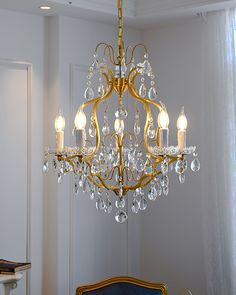 a chandelier hanging from the ceiling in a room