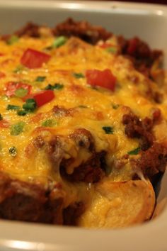 a casserole dish with meat, cheese and vegetables