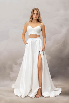 The Teffa Skirt is cut from structural Thai Taffeta that lends her her voluminous charm. Featuring a thick waistband that cinches in the small of the waist, an eye-catching thigh-high split, asymmetrical waist pleats and a sweeping train, this dramatic skirt is the perfect option for the modern bride. Wedding Dress Separates, Wedding Dress Aesthetic, Prom Skirt, Catherine Deane, Wedding Dress Outfit, Statement Skirt, Knife Pleat, Bridal Skirts, Wedding Skirt