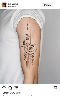 a man with a tattoo on his arm that has an image of planets and stars