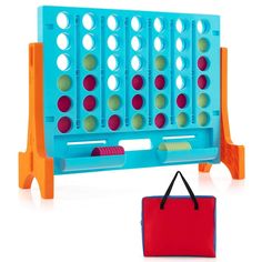 a blue and orange board game with two pieces in it next to a red bag