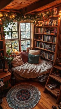 a room with a bed, bookshelf and lights in the window sill