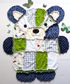 a teddy bear made out of quilts and fabric