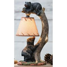 a bear lamp sitting on top of a wooden table