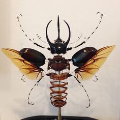 an insect sculpture on top of a table