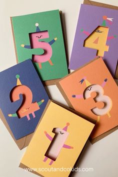 four different colored cards with numbers and animals on them, one is for the number three