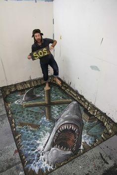 a man standing on top of a shark in the middle of a floor with a sign